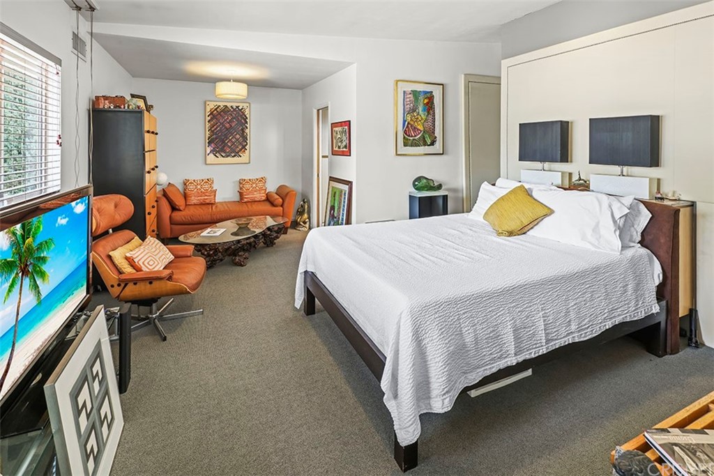 5265 Old Road Riverside, CA 92504 - Photo 48 of 75 a bed room with a bed and a flat screen tv