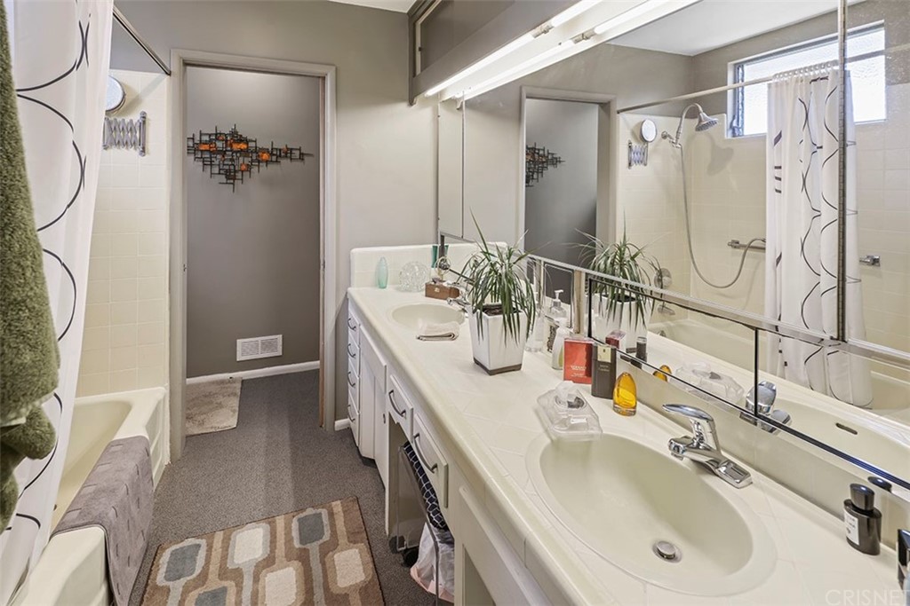 5265 Old Road Riverside, CA 92504 - Photo 51 of 75 a bathroom with a sink a toilet and shower