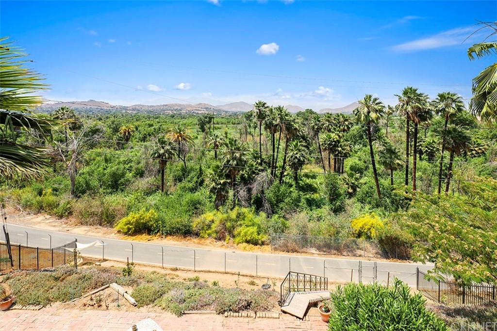5265 Old Road Riverside, CA 92504 - Photo 64 of 75 a view of a yard with plants and a bench