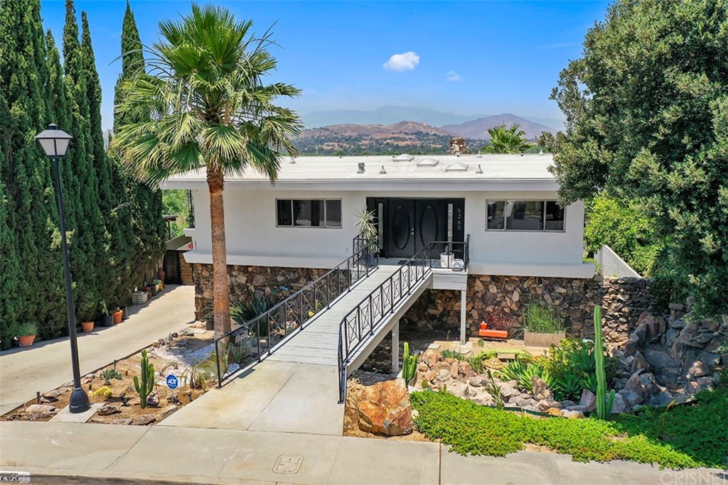 5265 Old Road Riverside, CA 92504 - Photo 68 of 75 a view of a house with a yard and potted plants