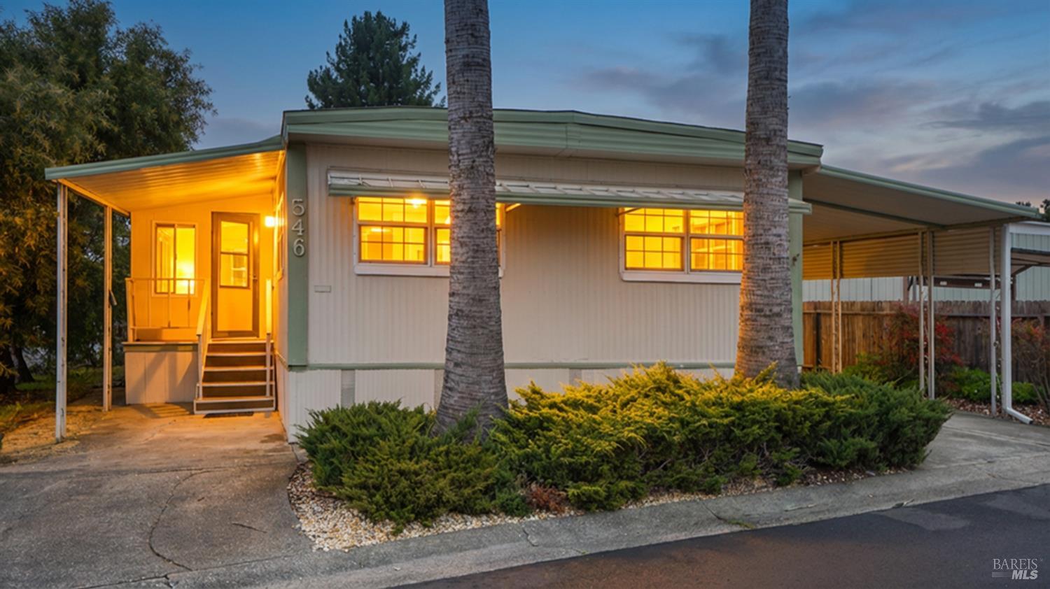 a front view of house and yard with green space