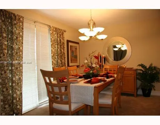 a kitchen with stainless steel appliances a sink cabinets and a refrigerator