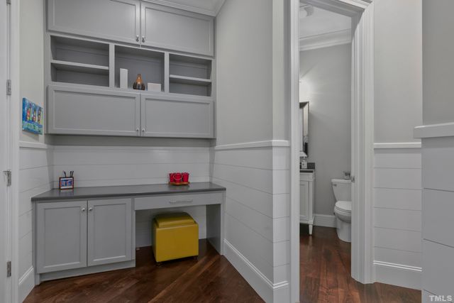 a view of bathroom with a sink toilet and wooden floor