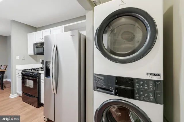 a kitchen with a washer and dryer