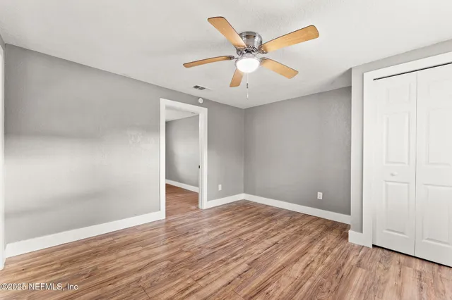 a kitchen with granite countertop a refrigerator stove top oven and sink