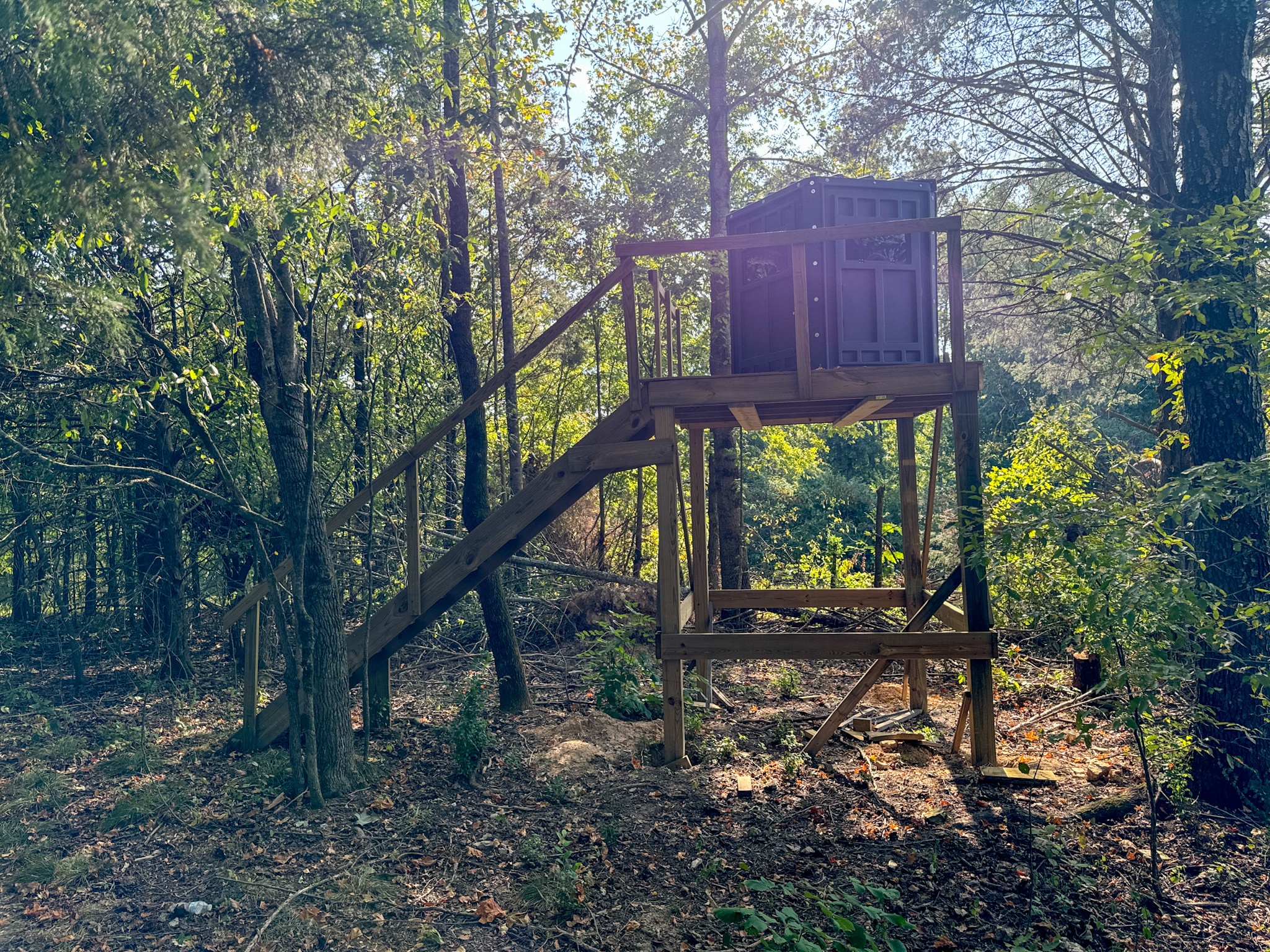 944 Shoal Bluff Road Minor Hill, TN 38473 - Photo 48 of 55 a view of a wooden deck and a forest