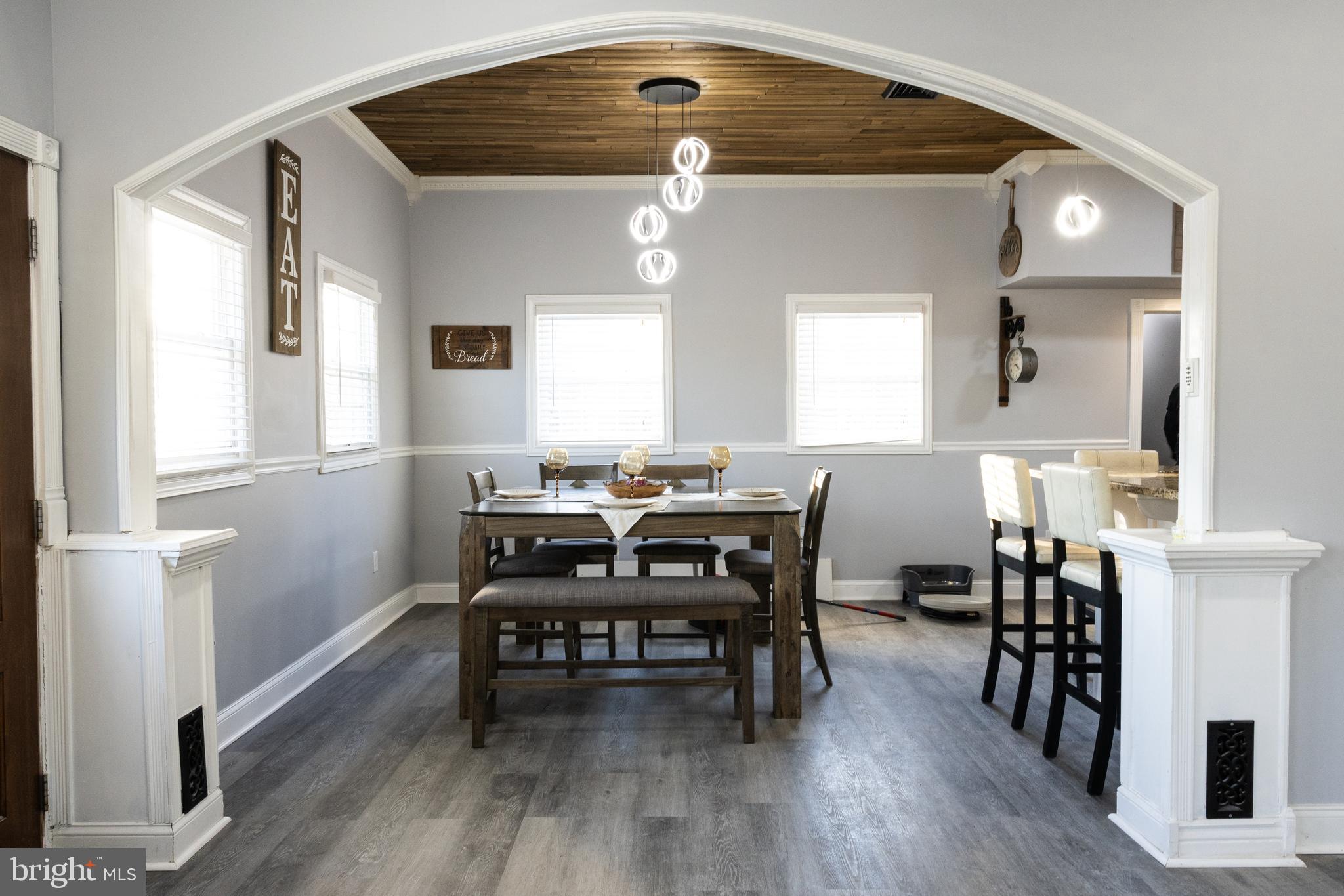 1476 South Orchard Road Vineland, NJ 08360 - Photo 11 of 37 a view of a a dining room with furniture window and wooden floor