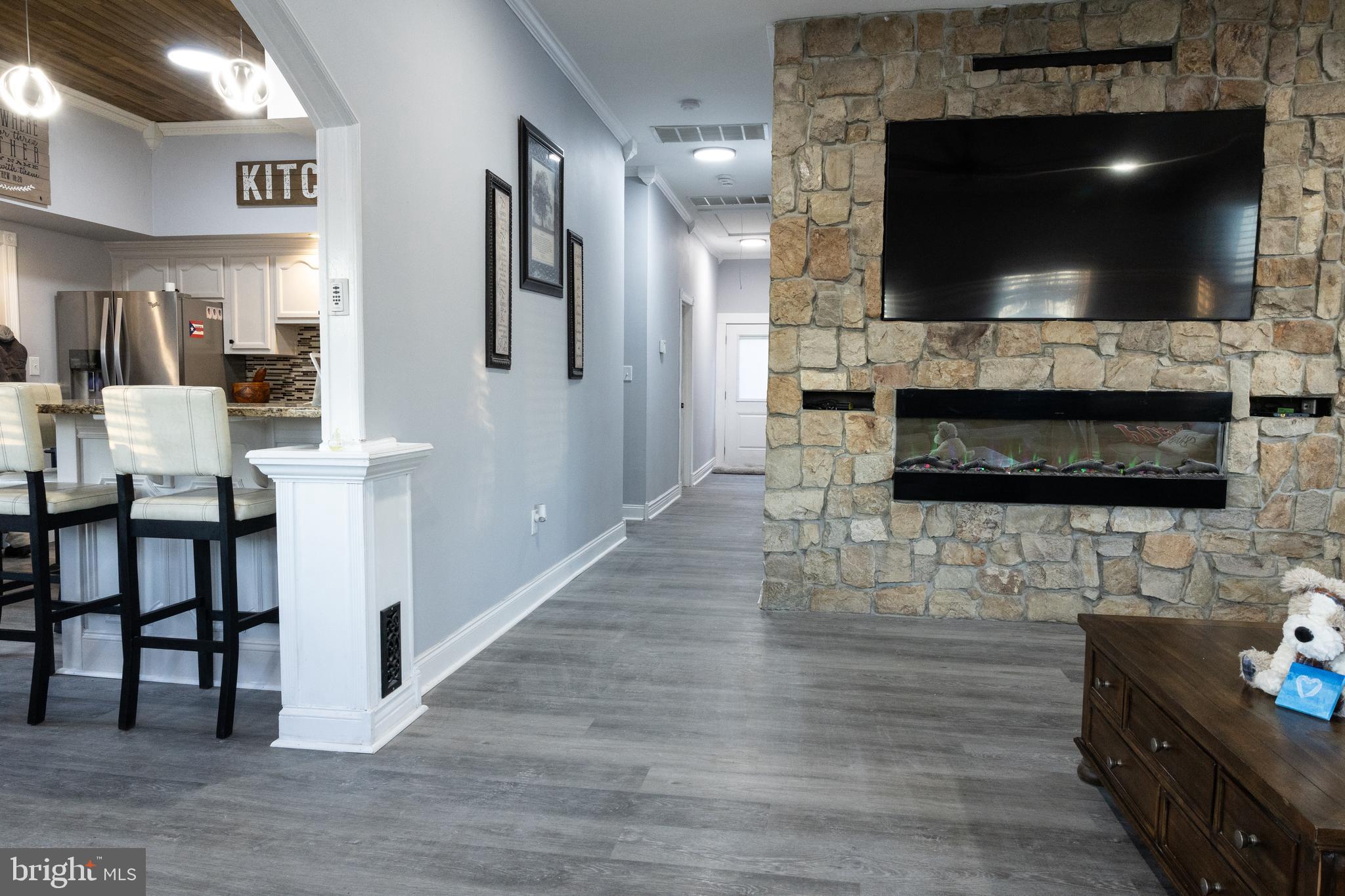 1476 South Orchard Road Vineland, NJ 08360 - Photo 18 of 37 a living room with fireplace and a flat screen tv