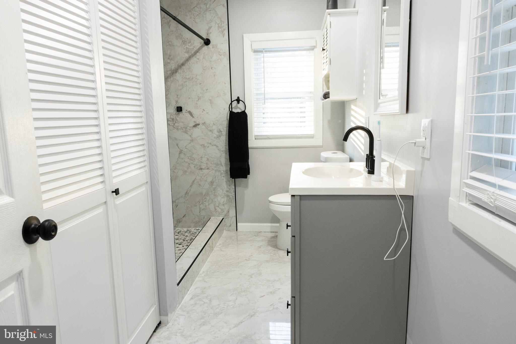 1476 South Orchard Road Vineland, NJ 08360 - Photo 20 of 37 a en suite bathroom with a sink and a mirror