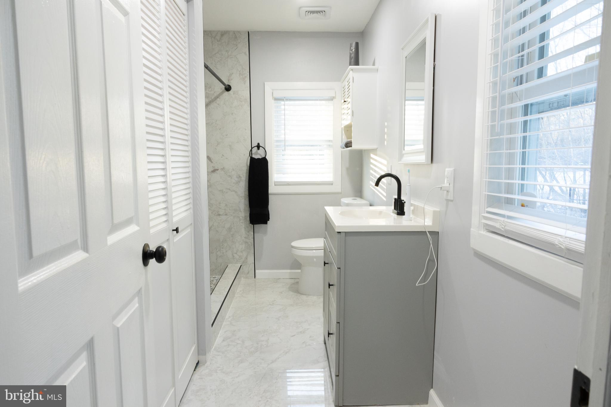 1476 South Orchard Road Vineland, NJ 08360 - Photo 21 of 37 a bathroom with a sink toilet and shower