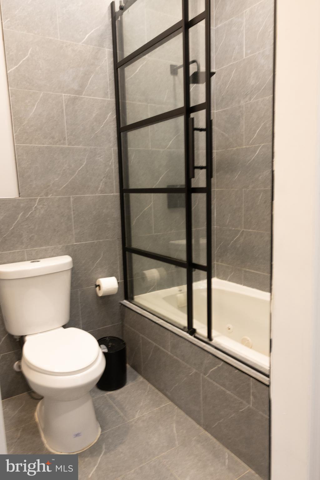 1476 South Orchard Road Vineland, NJ 08360 - Photo 28 of 37 a white toilet sitting next to a bathtub