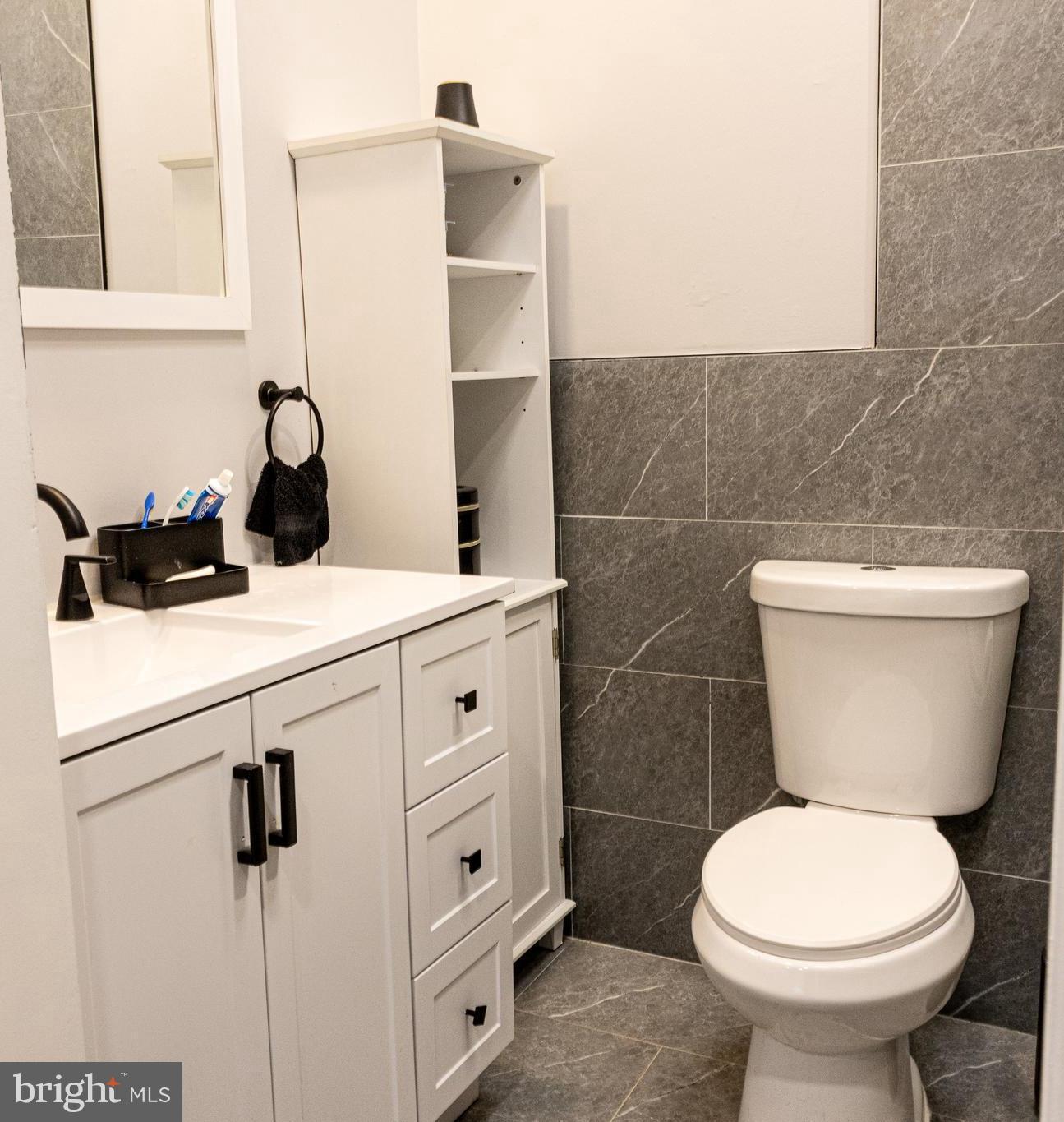 1476 South Orchard Road Vineland, NJ 08360 - Photo 31 of 37 a bathroom with a toilet sink and mirror