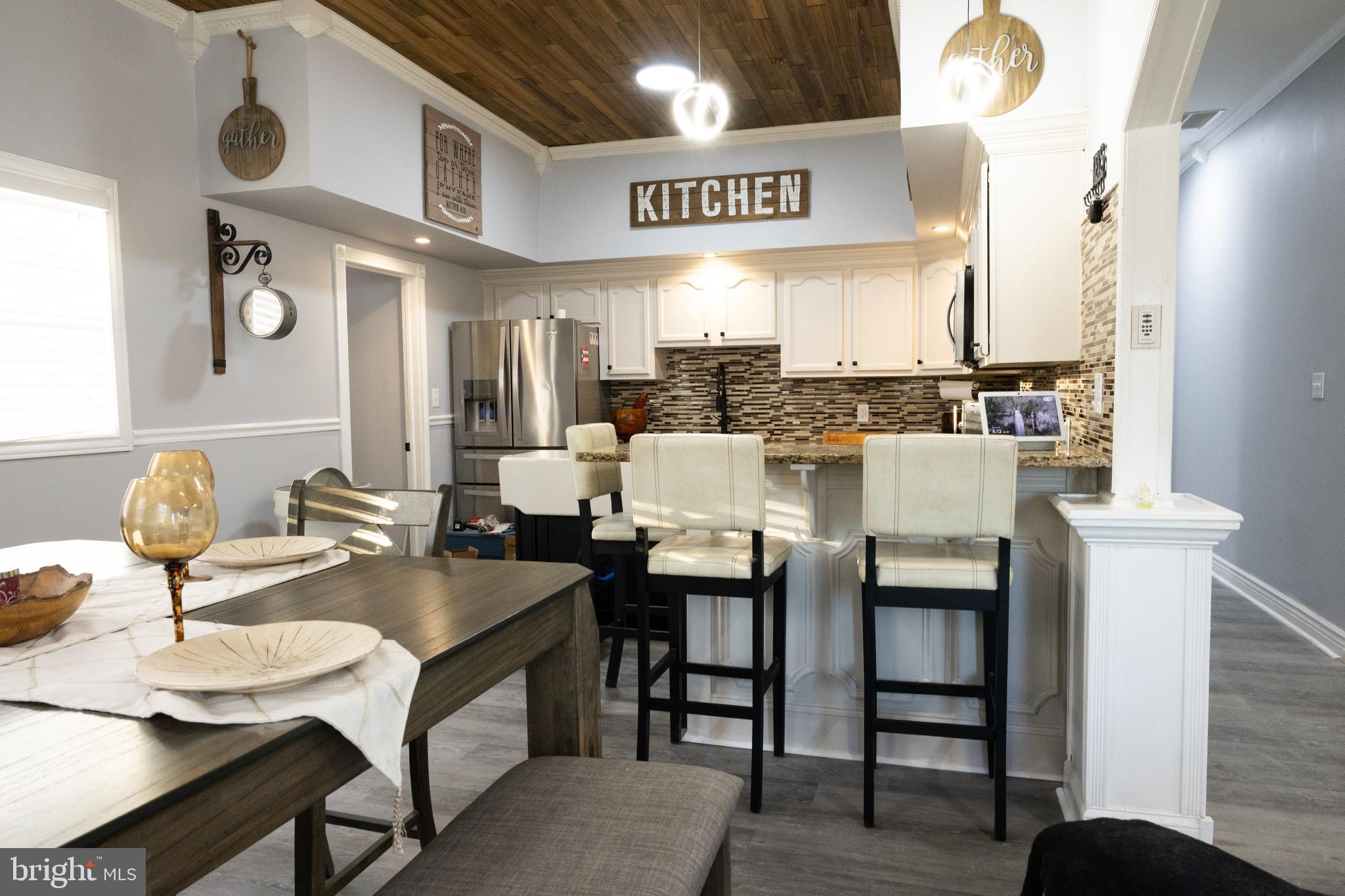 1476 South Orchard Road Vineland, NJ 08360 - Photo 5 of 37 a dinning room with kitchen island furniture and a chandelier