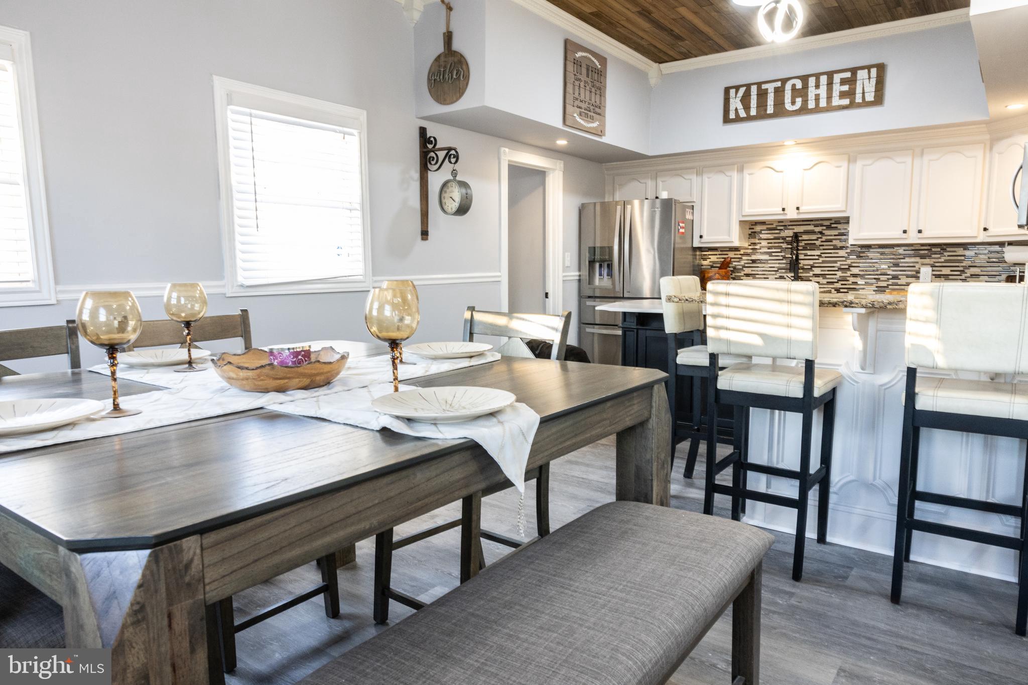 1476 South Orchard Road Vineland, NJ 08360 - Photo 6 of 37 a kitchen with a table chairs sink and cabinets