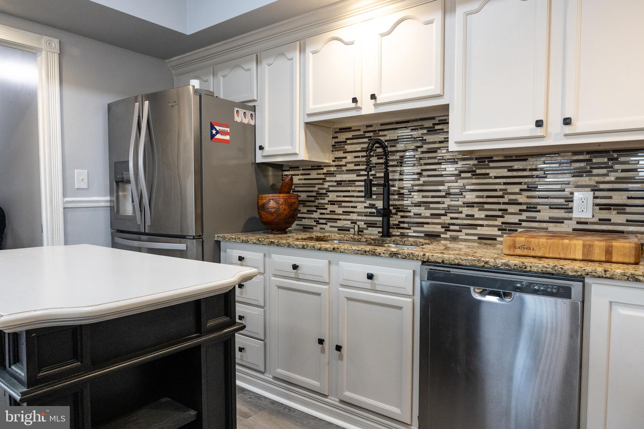 1476 South Orchard Road Vineland, NJ 08360 - Photo 8 of 37 a kitchen with stainless steel appliances cabinets and wooden floor