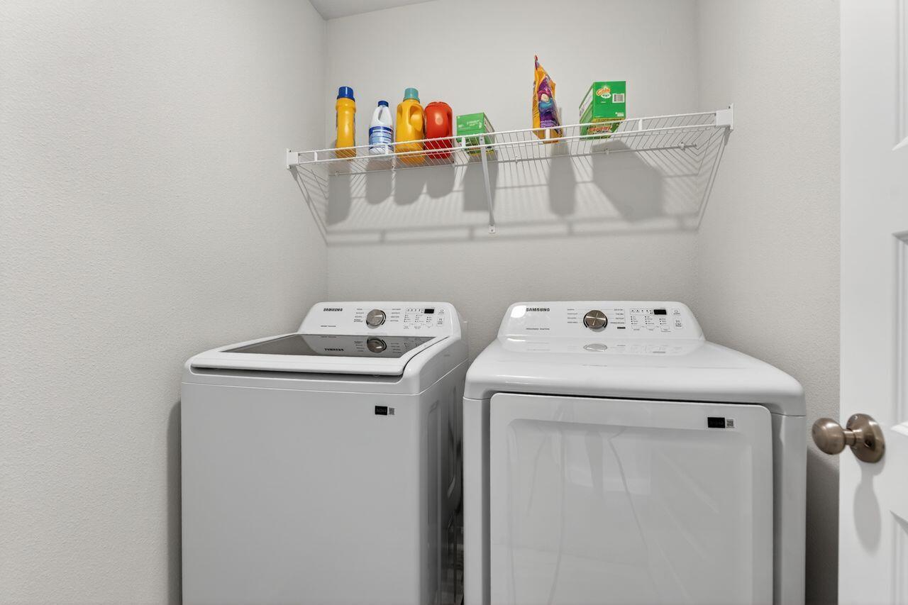 2637 Saltgrass Way Crestview, FL 32536 - Photo 16 of 47 a utility room with dryer and washer
