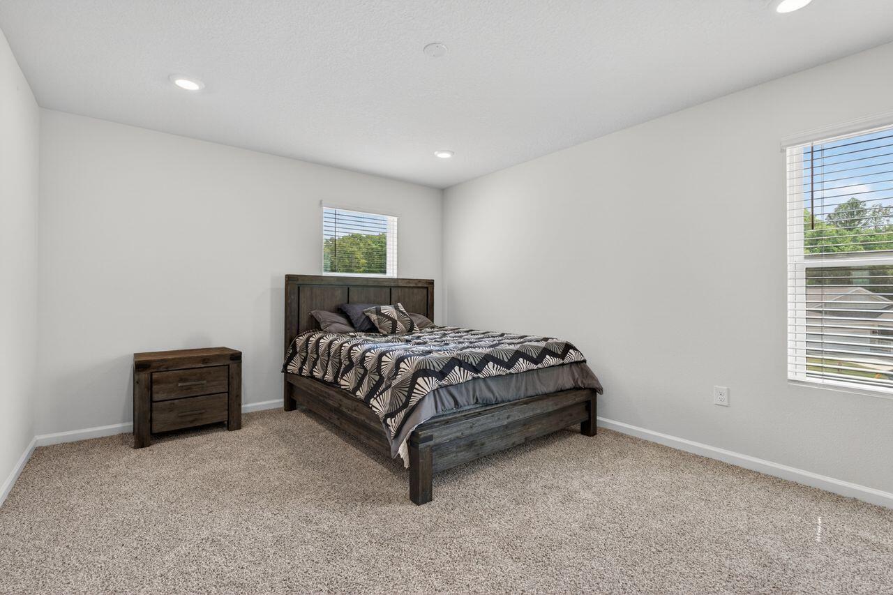 2637 Saltgrass Way Crestview, FL 32536 - Photo 18 of 47 a bedroom with a bed and a window