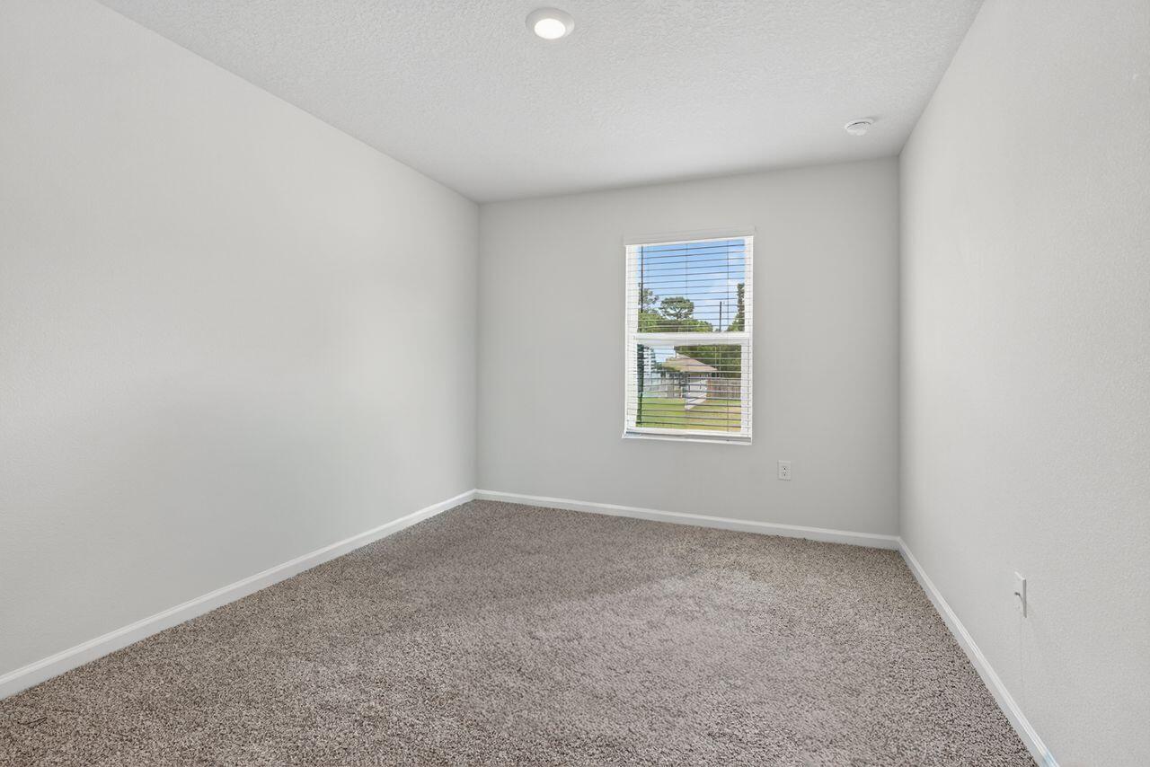 2637 Saltgrass Way Crestview, FL 32536 - Photo 21 of 47 an empty room with a window