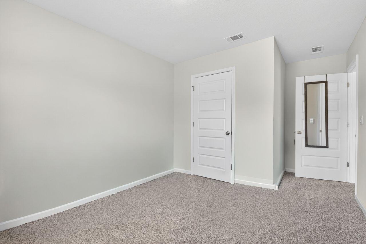 2637 Saltgrass Way Crestview, FL 32536 - Photo 24 of 47 an empty room with closet area
