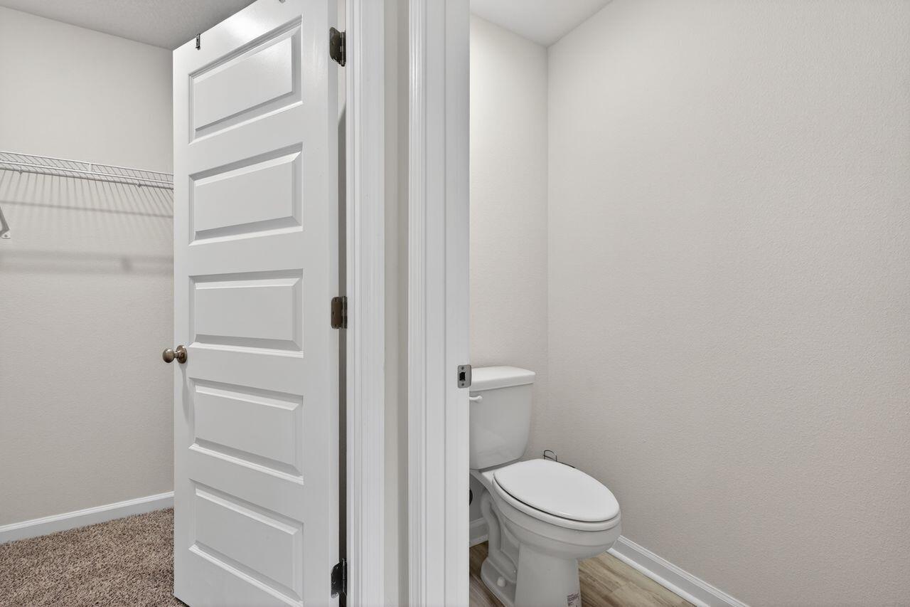 2637 Saltgrass Way Crestview, FL 32536 - Photo 34 of 47 a white toilet sitting next to a shower