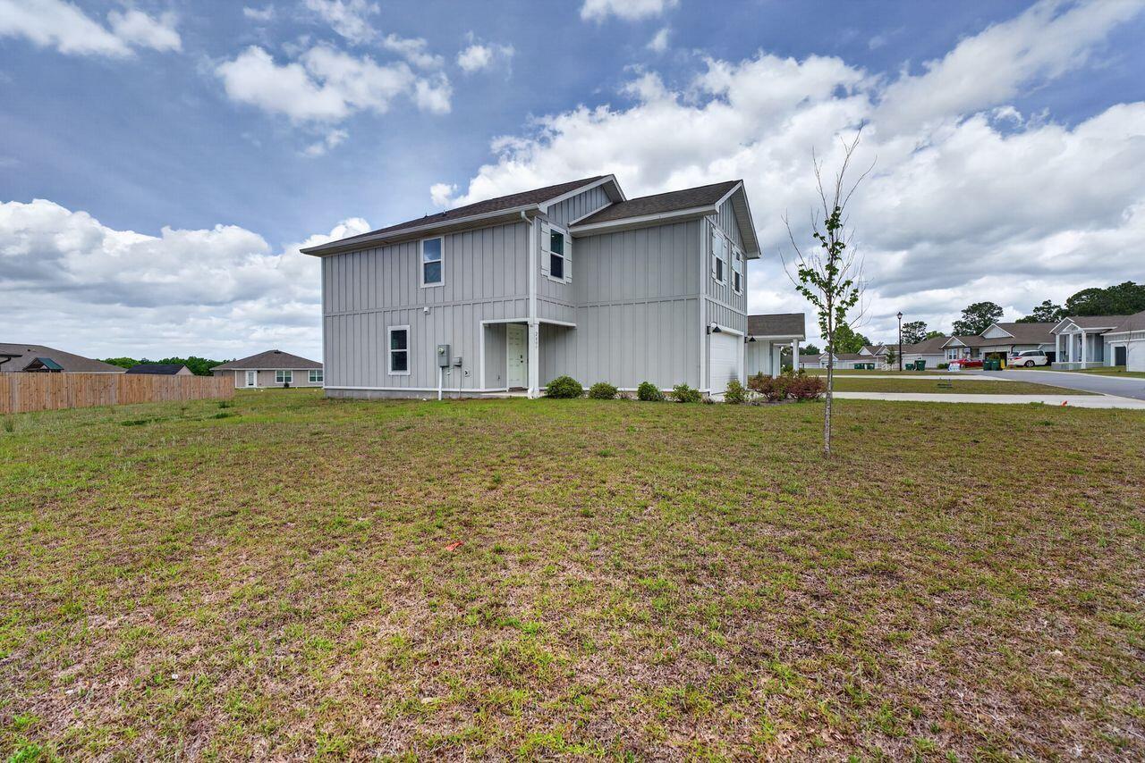 2637 Saltgrass Way Crestview, FL 32536 - Photo 41 of 47 a view of a house with a yard
