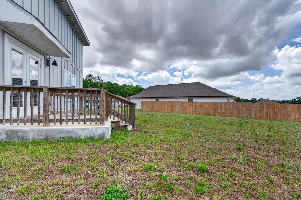 2637 Saltgrass Way Crestview, FL 32536 - Photo 42 of 47 a view of a house with backyard and porch