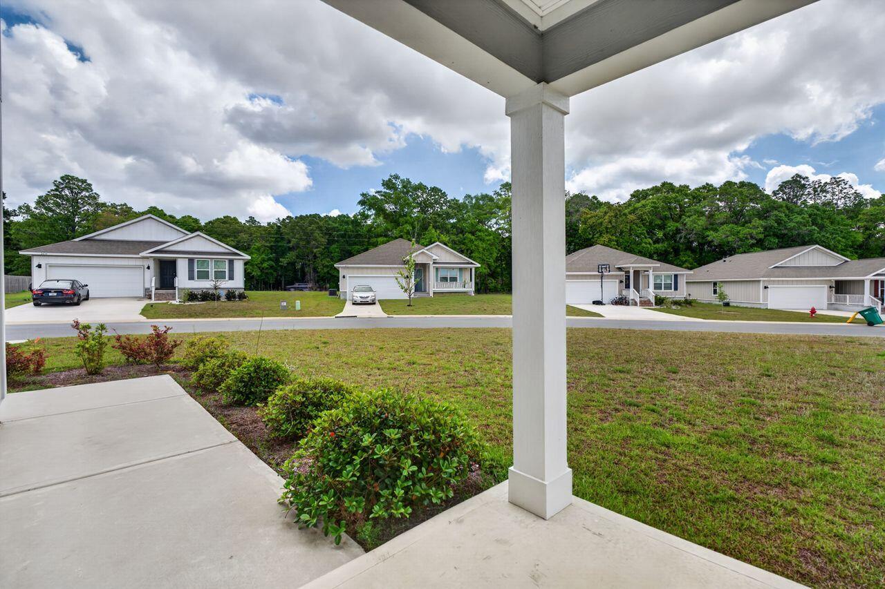 2637 Saltgrass Way Crestview, FL 32536 - Photo 6 of 47 a view of a house with garden