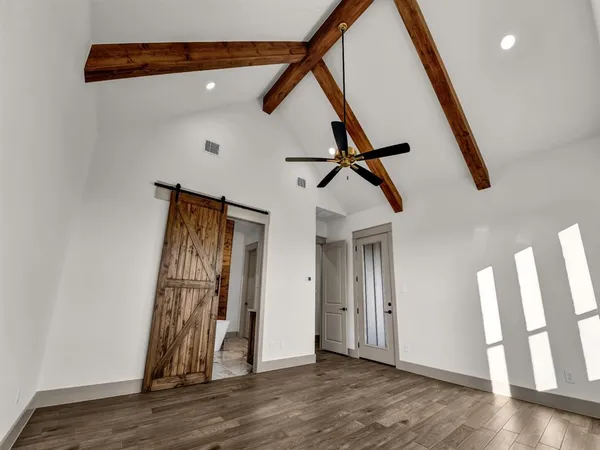 a view of an entryway with wooden floor