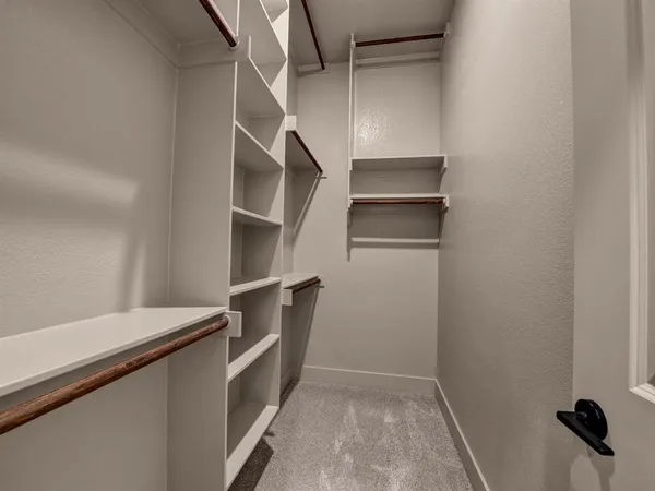 a view of an empty walk in closet
