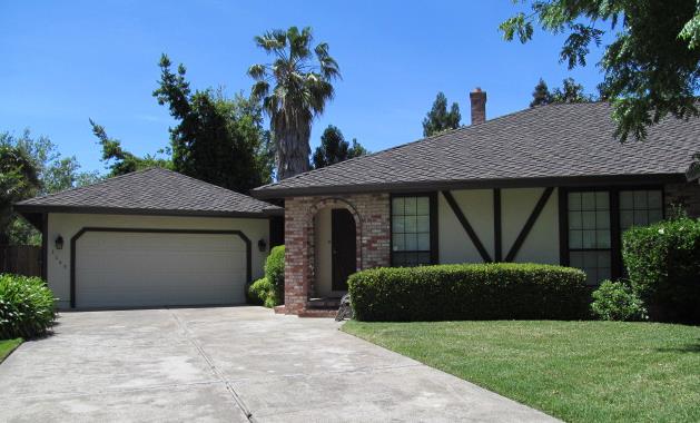1145 Spruce Tree Circle Sacramento, CA 95831 - Photo 1 of 1 a front view of a house with garden