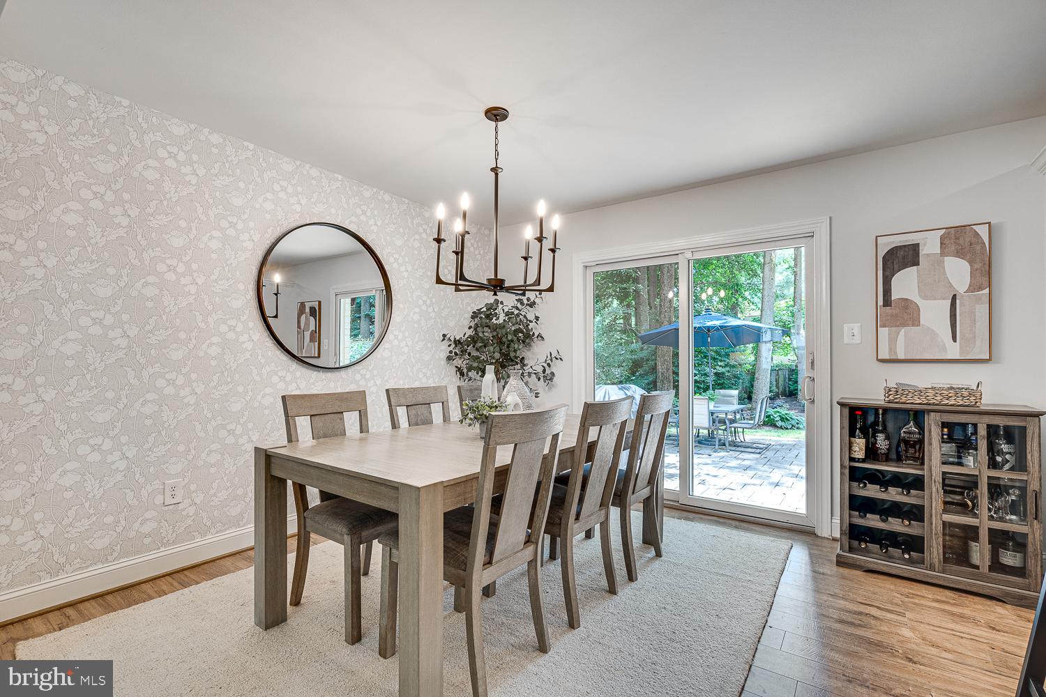 10197 Wavell Road Fairfax, VA 22032 - Photo 11 of 47 a dining room with furniture a chandelier and a rug