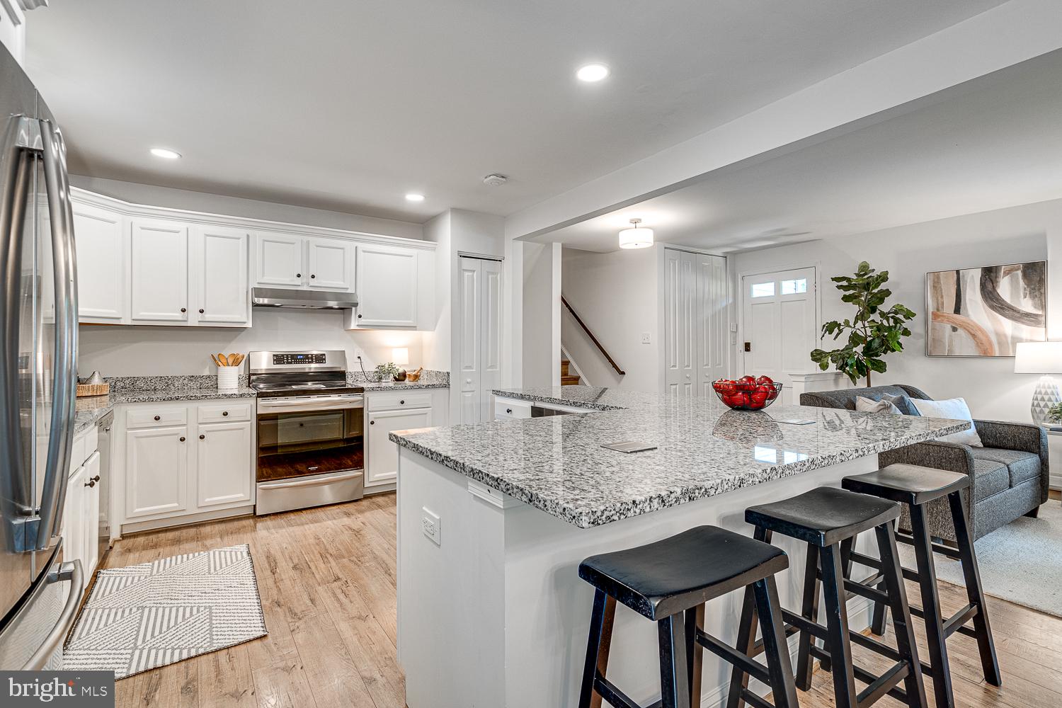 10197 Wavell Road Fairfax, VA 22032 - Photo 12 of 47 a kitchen with granite countertop white cabinets and stainless steel appliances