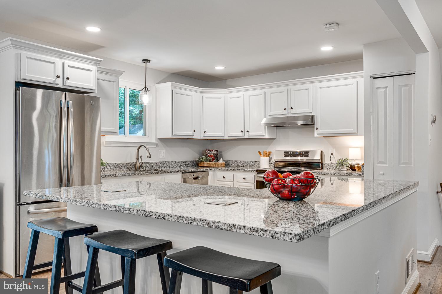 10197 Wavell Road Fairfax, VA 22032 - Photo 13 of 47 a kitchen with stainless steel appliances granite countertop a sink refrigerator and cabinets