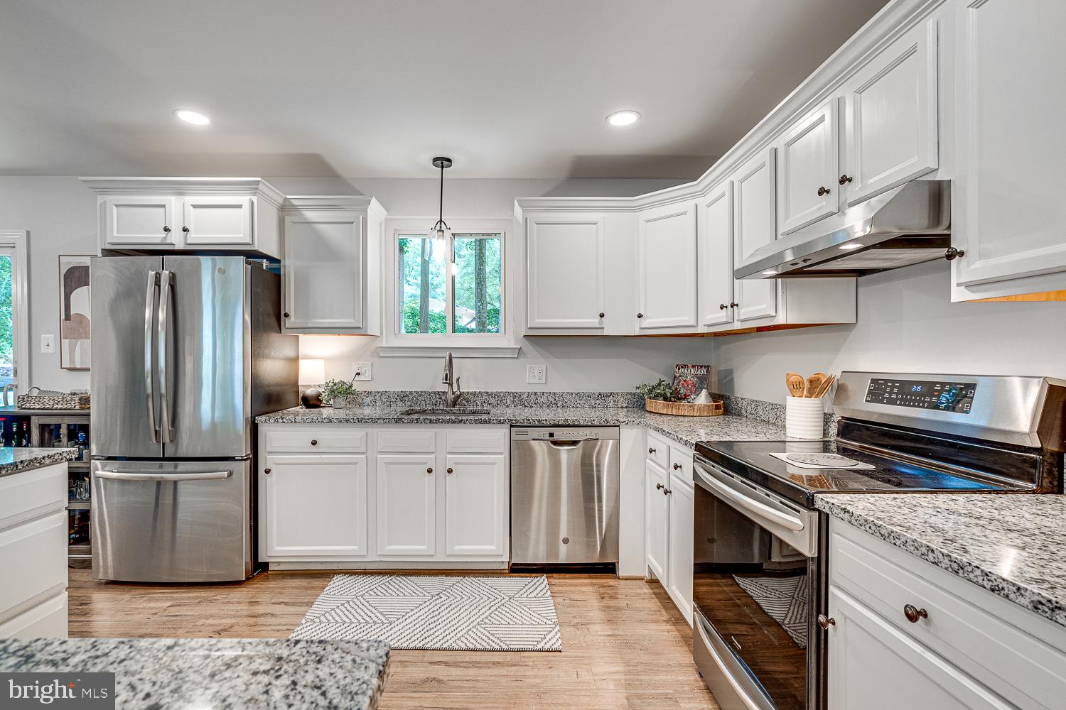 10197 Wavell Road Fairfax, VA 22032 - Photo 16 of 47 a kitchen with stainless steel appliances granite countertop a stove a refrigerator and a sink