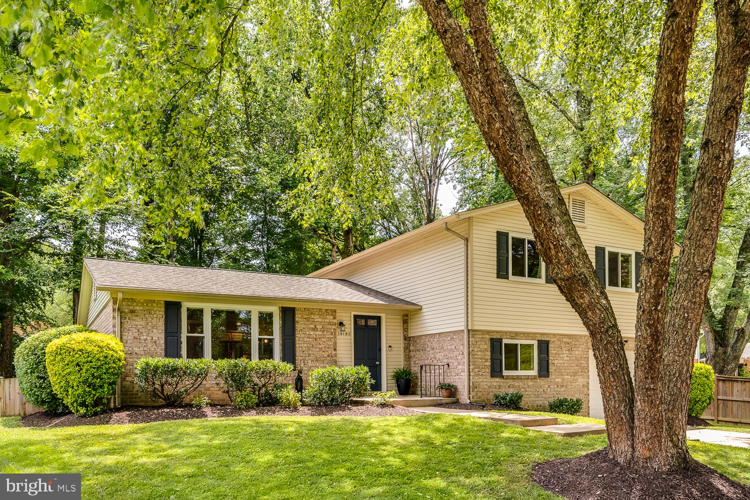 10197 Wavell Road Fairfax, VA 22032 - Photo 2 of 47 a front view of a house with garden