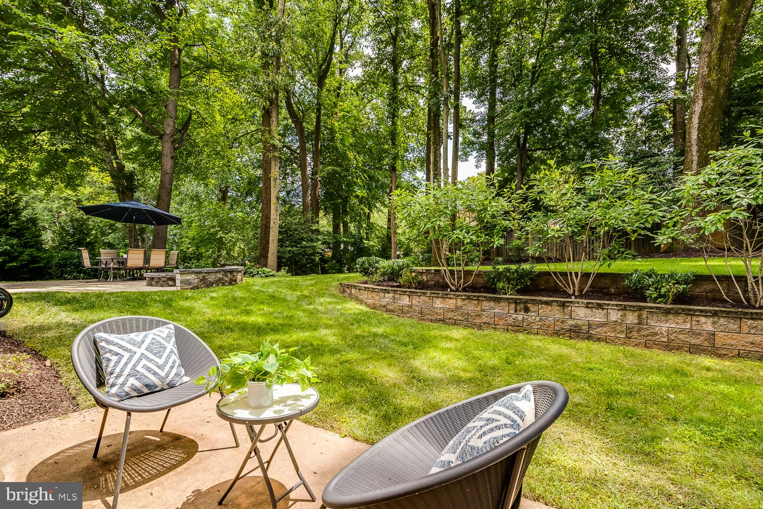 10197 Wavell Road Fairfax, VA 22032 - Photo 42 of 47 a view of a swimming pool with a table and chairs
