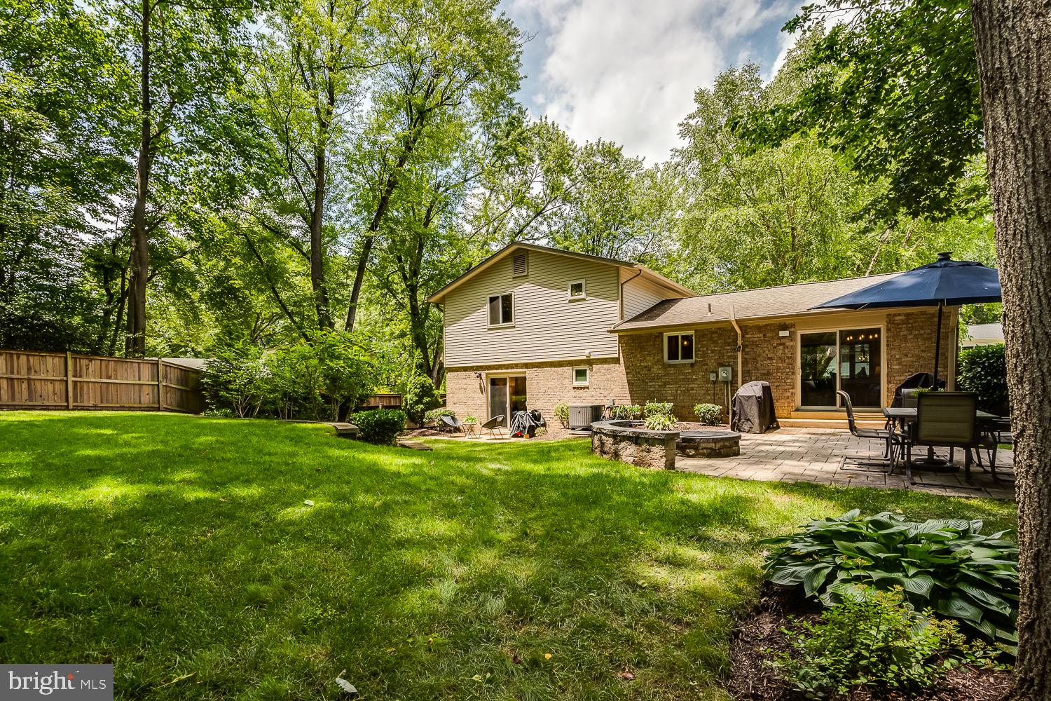10197 Wavell Road Fairfax, VA 22032 - Photo 46 of 47 a view of a house with a yard and sitting area