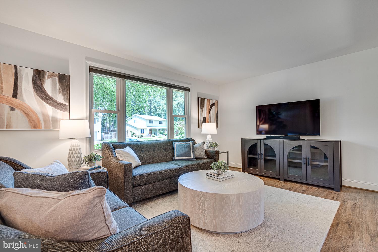 10197 Wavell Road Fairfax, VA 22032 - Photo 6 of 47 a living room with furniture and a flat screen tv