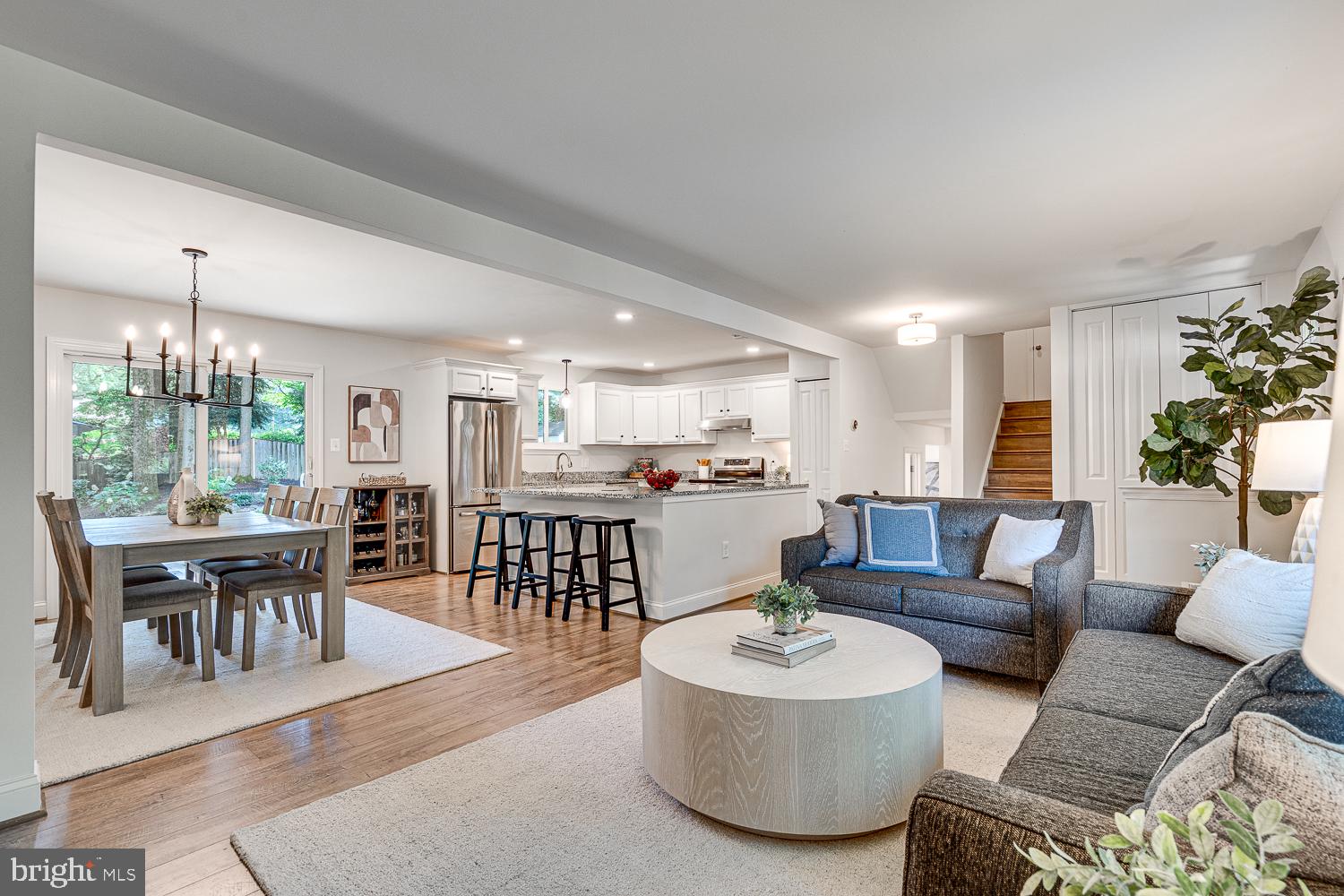 10197 Wavell Road Fairfax, VA 22032 - Photo 8 of 47 a living room with furniture and a dining table with kitchen view