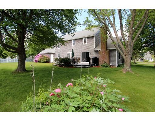 8 Knoll Top Road Sandwich, MA 02644 - Photo 2 of 25 a view of house with backyard outdoor seating and hardwood