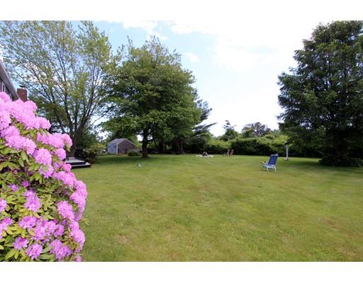 8 Knoll Top Road Sandwich, MA 02644 - Photo 6 of 25 a backyard of a house with lots of green space