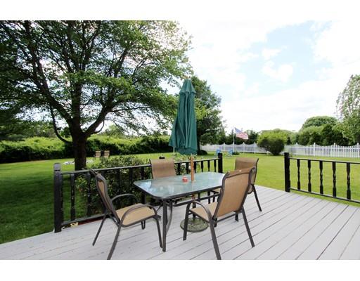 8 Knoll Top Road Sandwich, MA 02644 - Photo 7 of 25 a patio with wooden floor table and chairs