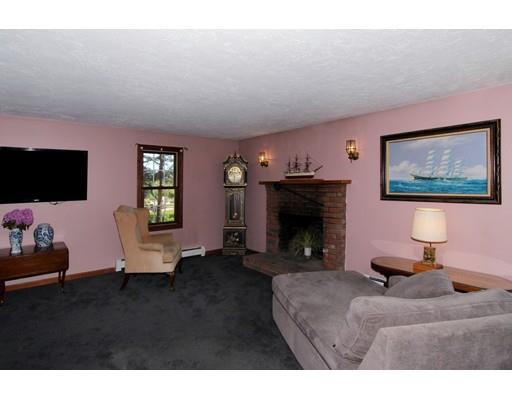 8 Knoll Top Road Sandwich, MA 02644 - Photo 9 of 25 a living room with furniture and a flat screen tv