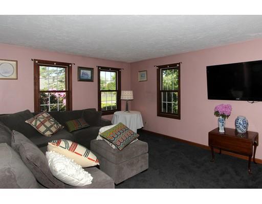 8 Knoll Top Road Sandwich, MA 02644 - Photo 10 of 25 a living room with furniture and a flat screen tv