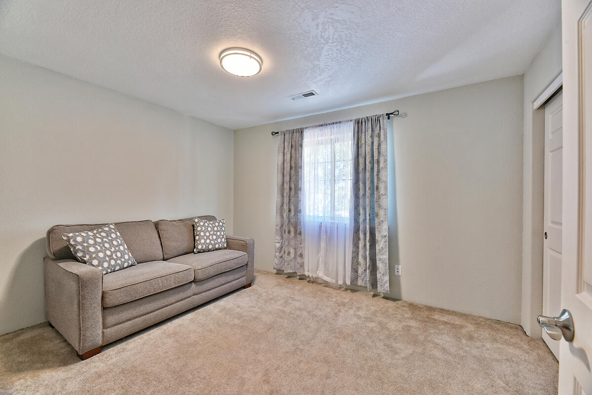 450 Midway Road, Unit 39 Medford, OR 97501 - Photo 15 of 21 a living room with furniture and a window
