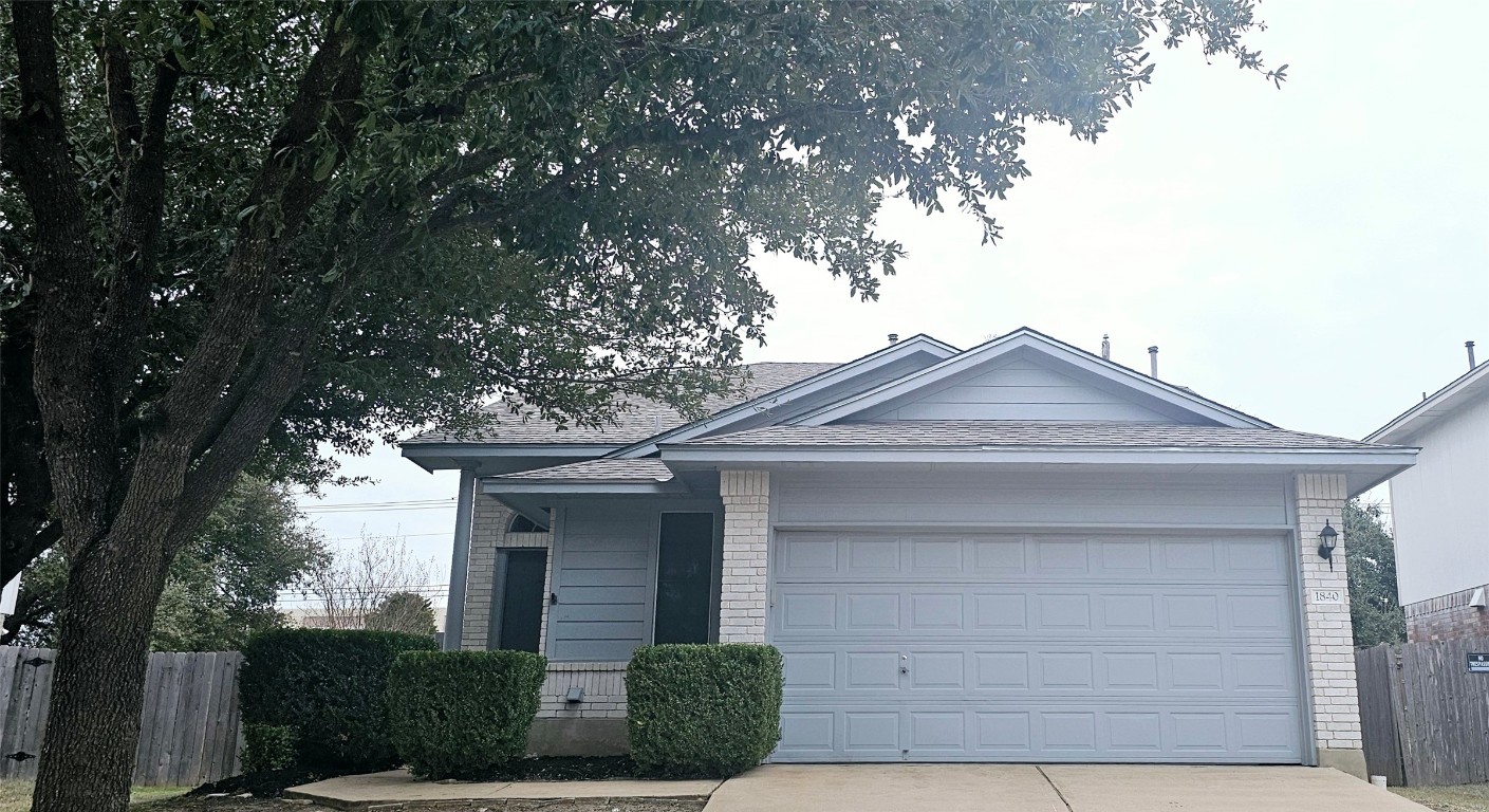 1840 Wallin Loop Round Rock, TX 78664 - Photo 5 of 17 a front view of a house with garden