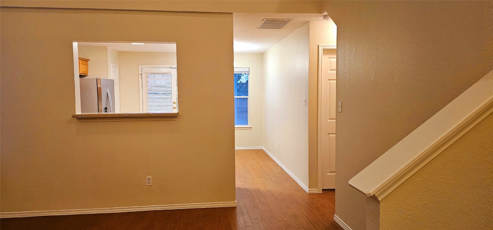1840 Wallin Loop Round Rock, TX 78664 - Photo 6 of 17 a view of a hallway with wooden floor and entryway
