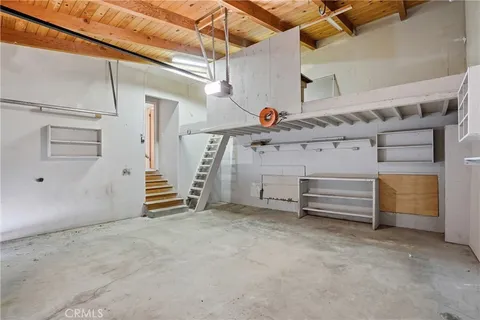 a view of an empty room with a white walls