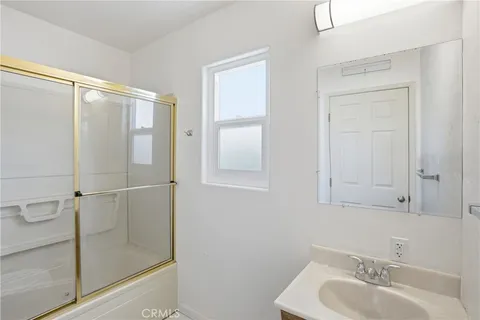 a bathroom with a sink and mirror