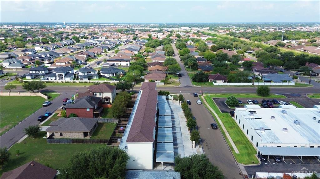 3302 South Sugar Road, Unit H Edinburg, TX 78539 - Photo 20 of 24 an aerial view of a house with a garden and lake view